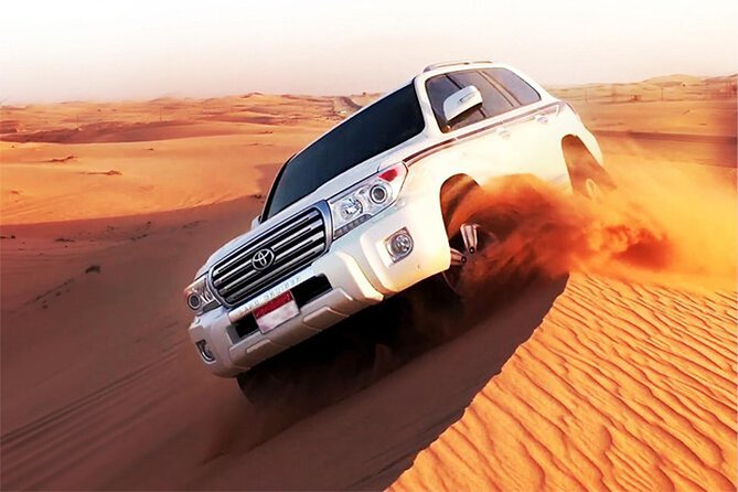 6-Hour Dubai Desert Dinner Safari with Dune Bashing & Camel Ride - Dune bashing across the Dubai sand