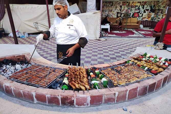 6 Hours Desert Safari Dubai Tour with BBQ Dinner & Live Shows - Dinner with BBQ, buffet dishes, and live performances