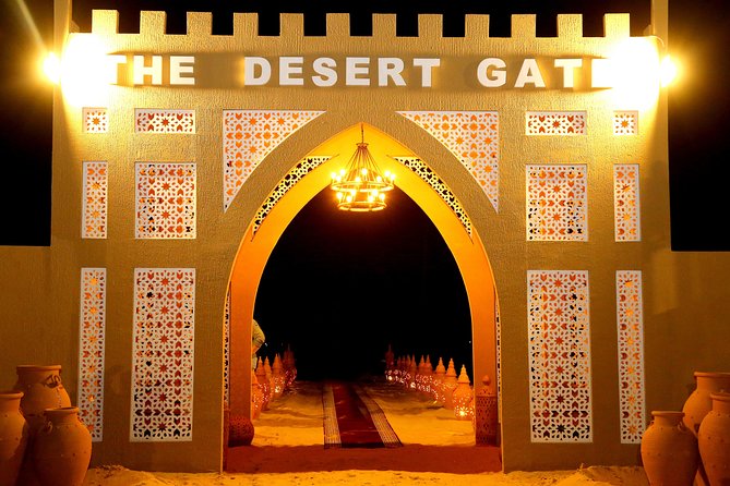 Abu Dhabi Afternoon Desert Safari and BBQ Dinner - Camel rides and sandboarding at the camp