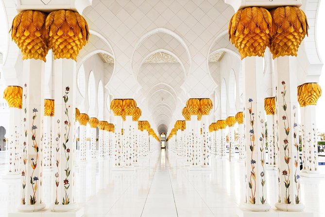 Abu Dhabi city tour & desert safari from Dubai - Sandboarding, camels, and sunset in the red dunes