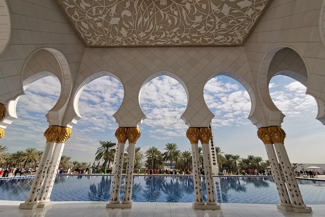 Abu Dhabi City Tour Including Ferrari World Tickets from Dubai - Abu Dhabi skyline, Louvre, and Corniche views