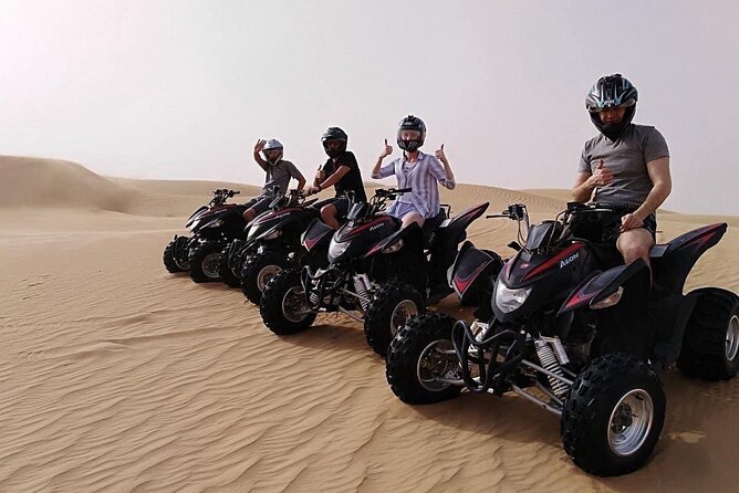 Abu Dhabi Desert Safari BBQ Dinner Live Shows Pick & Drop More - Sunset, sandboarding, and the camel stop