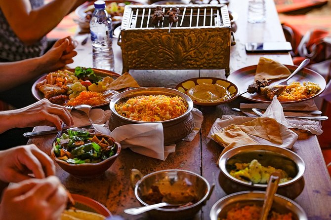 Abu Dhabi: Desert Safari with BBQ, Camel Ride & Sandboarding - Bedouin-style camp with coffee, dates, and cushions