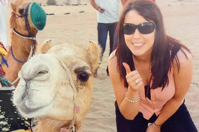 Arabian Desert Safari with BBQ Dinner Camel Ride, Sand Boarding - Camel rides and sand boarding