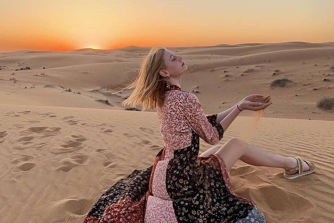 Arabian Desert Safari with BBQ Dinner Camel Ride, Sand Boarding - Tanoura, fire, and belly-dancing shows