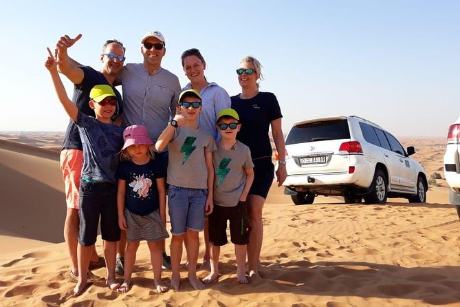 Best Dubai Desert Safari with Buffet Dinner,Sand Boarding & Shows - Camel riding and a short taste of camp life