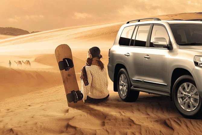 Camel Trekking and Morning Safari with Sand Boarding - Sandboarding down a high dune