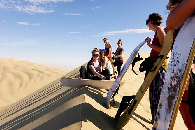 Camel Trekking Dubai with Dune Bashing and Sand Boarding - Sandboarding on the dunes