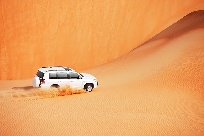 Desert Safari Abu Dhabi w/ Sand Boarding, Camel Ride & BBQ Dinner - Sand boarding, costumes, and the Bedouin-style camp