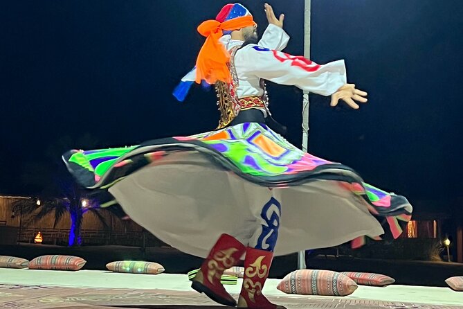 Desert Safari Abu Dhabi w/ Sand Boarding, Camel Ride & BBQ Dinner - Belly dancing, tanoura, and the evening finish