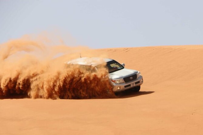 Desert Safari Adventure Hotel Transfer Camel Ride with Quadbike - Sandboarding adds a simple desert challenge