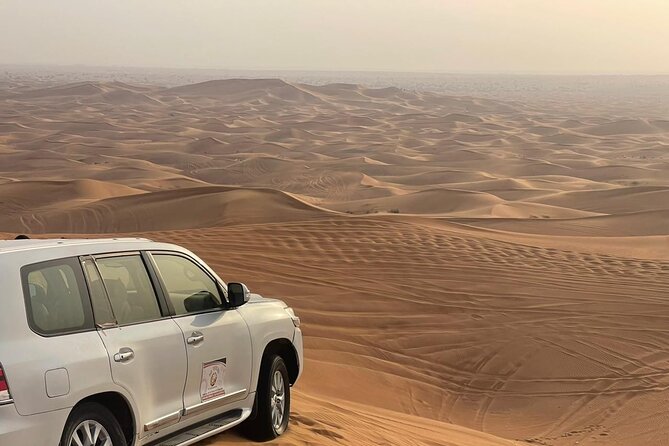 Desert safari adventure with BBQ dinner - Camel rides and sandboarding at Al Khaima Tours