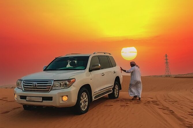 Desert Safari Dubai Tour with Dune Bashing, Camel Ride, & BBQ - From Dubai hotels to the open desert