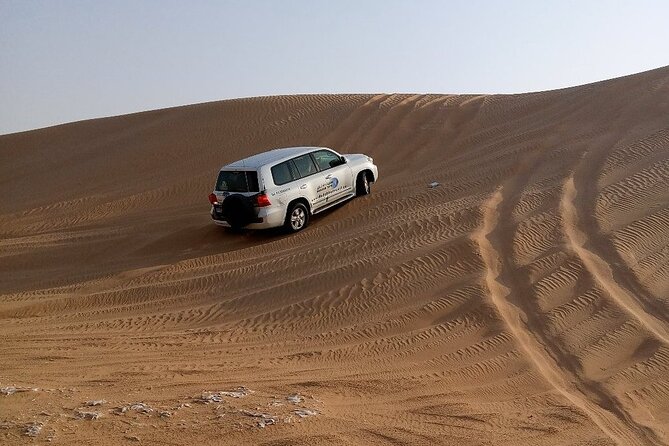 Desert Safari Dubai with BBQ Dinner and Belly Dance - Sunset photos provide a welcome pause