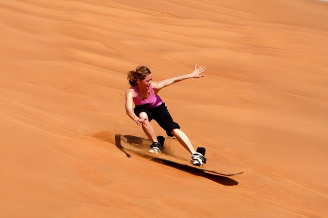 Desert Safari Dubai with BBQ Dinner, Sand Boarding & Camel Ride - Dune bashing and sandboarding in Lahbab