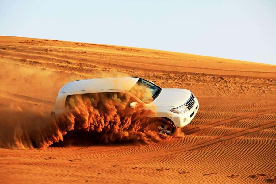 Desert Safari Dubai with Camel Ride, Sandboarding & Dinner - Quad biking across Lahbab