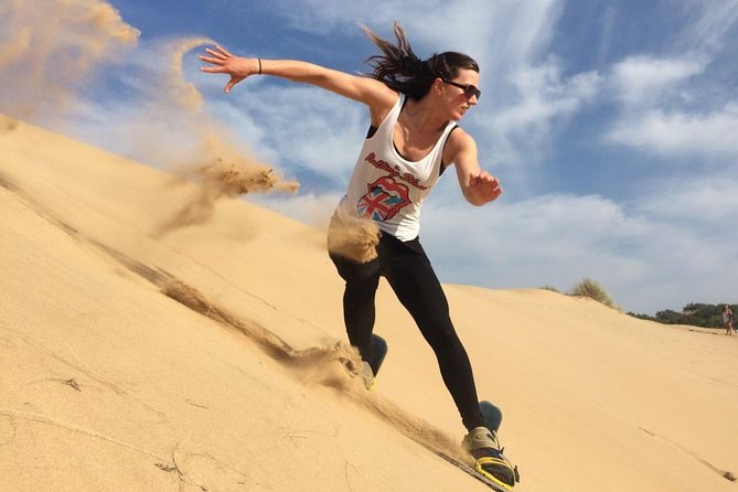 Desert Safari Morning with Camel Ride and Sand Boarding - Sandboarding on the high dunes