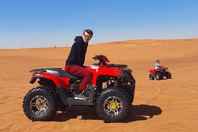 Desert Safari Quad Bike Activity with Dinner in Dubai - Sunset views and sandboarding