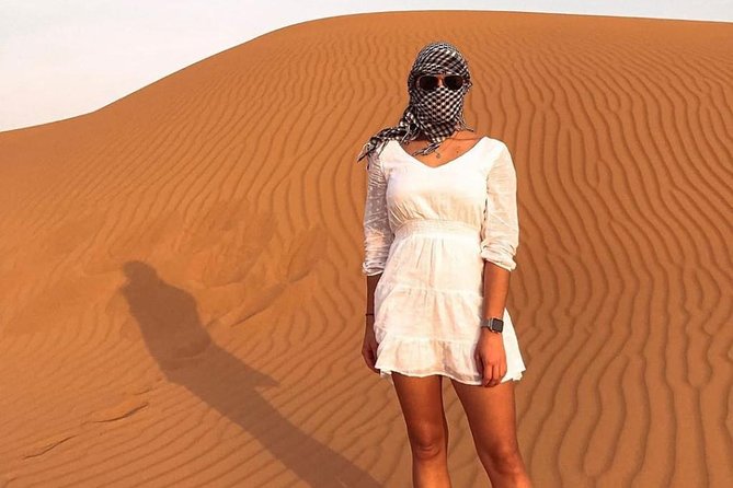 Desert Safari Red Dunes with Camel Ride, Sandboard, BBQ and Shows - Sunset BBQ and Buffet Dinner