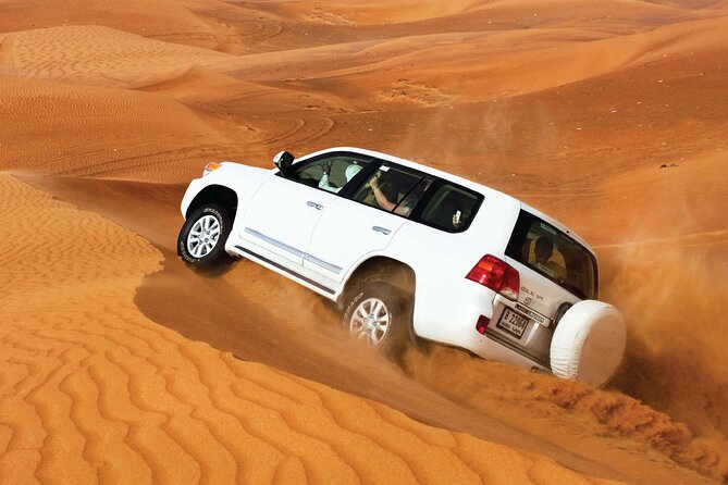 Desert Safari Redsand Dunes with BBQ Dinner in Dubai - Red dunes, photo stops, and the first burst of excitement