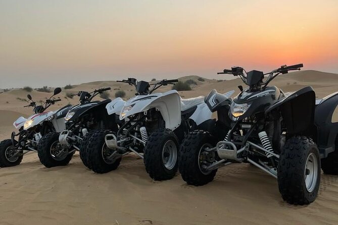 Desert Safari W/BBQ Dinner, Quad Bike, Camel Ride, & Sandboarding - Dune bashing with a steady hand