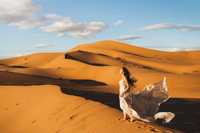 Desert Safari with BBQ Dinner, Camel Ride, Sand Board & Live Show - Sandboarding and camel riding at the camp