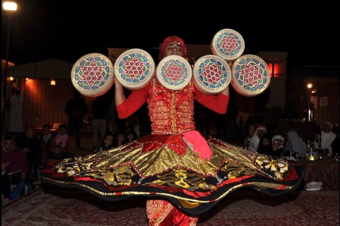 Desert Safari with BBQ Dinner, Camel Ride, Sand Board & Live Show - Belly dance, fire, and tanura shows