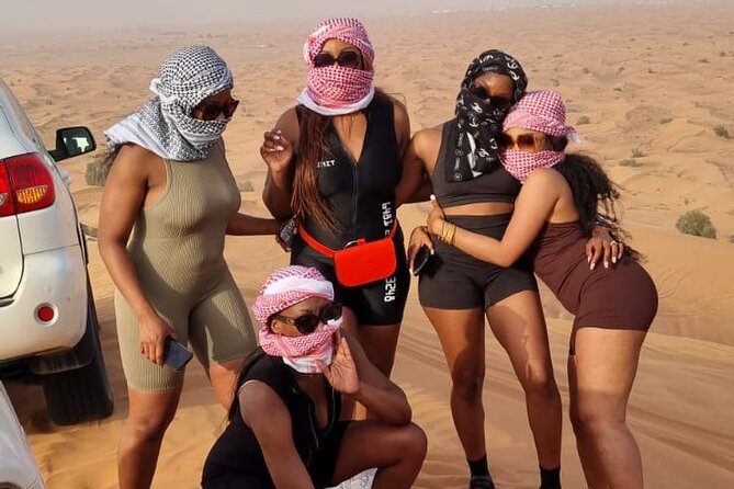 Desert Safari With BBQ Dinner, Quad Bike & Camel Ride from Dubai - Camel riding, falcons, tea, and Arabic snacks