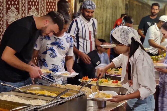 Desert Safari with Dune Bashing and Dinner In Dubai - Camel riding offers a short taste of desert tradition