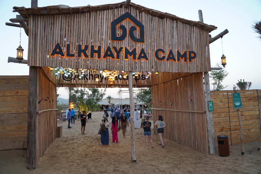 Dubai: Al Khayma Camp Experience with BBQ Dinner - Sunset over the red dunes