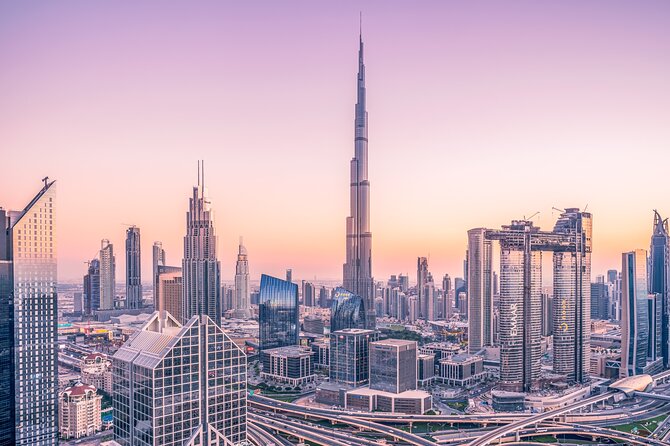 Dubai City Tour with Hotel Transfers - Jumeirah Public Beach: sand, skyline, and a famous hotel