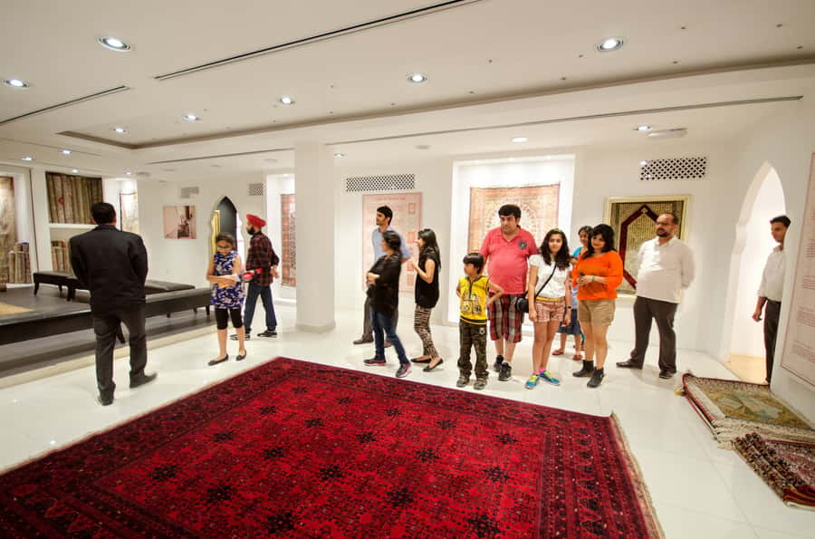 Dubai Cityscape and Desert Safari Full-Day Tour - Camel riding and sandboarding at the camp