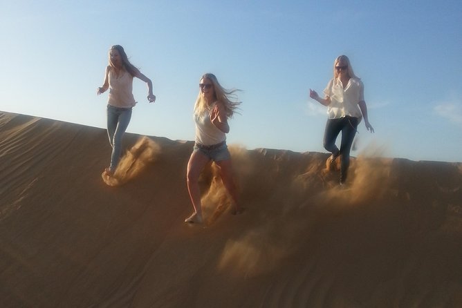 Dubai Desert Afternoon Quad Safari with Camel Ride, BBQ Dinner and Belly Dancing - A Bedouin-style camp in the folds of the dunes