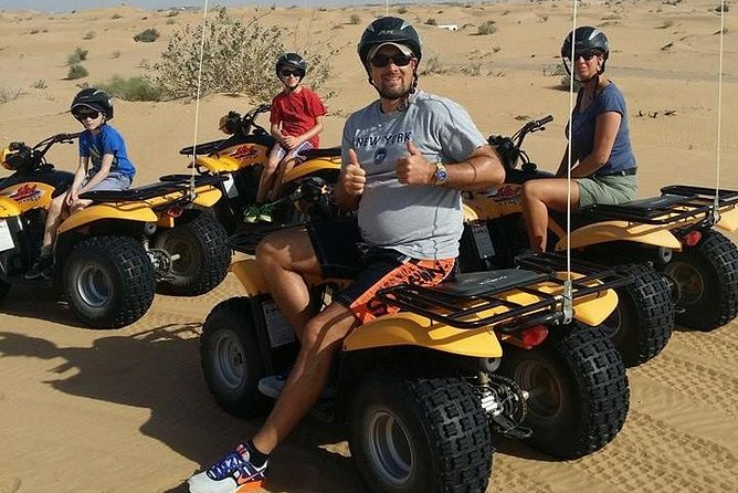 Dubai Desert Afternoon Quad Safari with Camel Ride, BBQ Dinner and Belly Dancing - Quad biking across the evening dunes