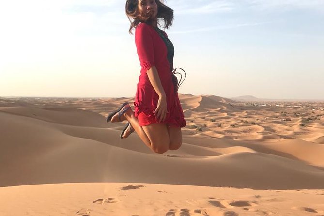 Dubai Desert Red Dune Half-Day Safari Adventure and BBQ Dinner - Sand boarding, with a low-key extra thrill