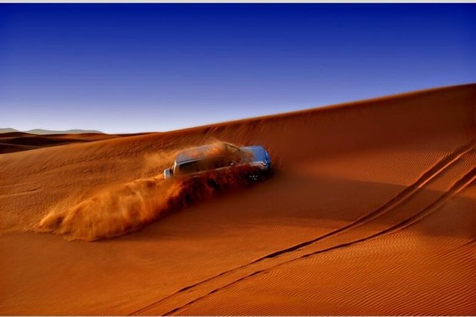 Dubai Desert Red Dune Half-Day Safari Adventure and BBQ Dinner - Entering the Bedouin-style desert camp