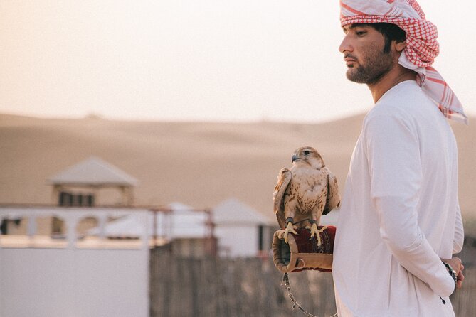 Dubai Desert Safari: 4x4 Dune Bashing, Camel Ride & BBQ Dinner - Meeting a falcon and learning about Emirati tradition