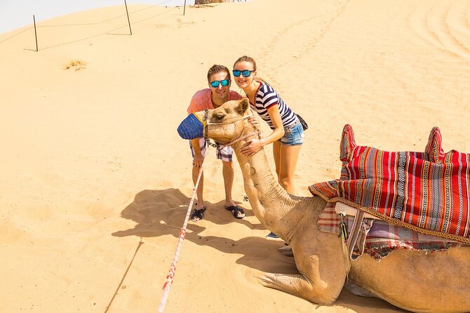 Dubai Desert Safari: 4x4 Dune Bashing, Camel Ride & BBQ Dinner - Tanaura, belly dance, and fire performances