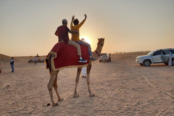 Dubai: Desert Safari 4x4 Dune with Camel Riding and Sandboarding - Barbecue buffet and Arabian sweets