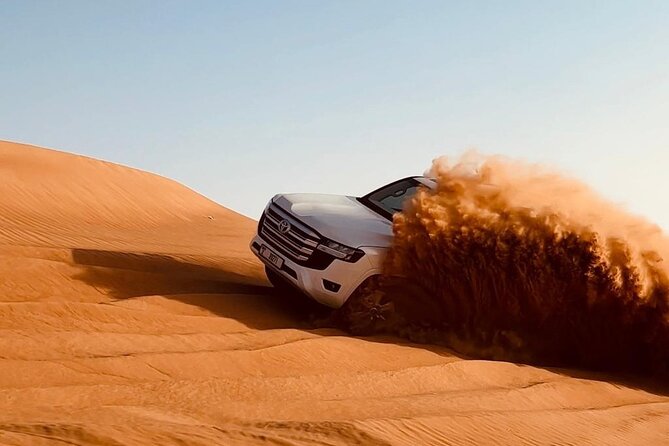 Dubai Desert Safari, Camel Ride, Entertainment Shows & BBQ Dinner - Dune bashing on Lahbab’s tall red sand