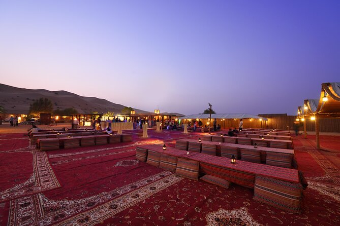 Dubai Desert Safari: Camel Ride, Sandboarding, BBQ & House Drinks - Camel riding and sandboarding at camp