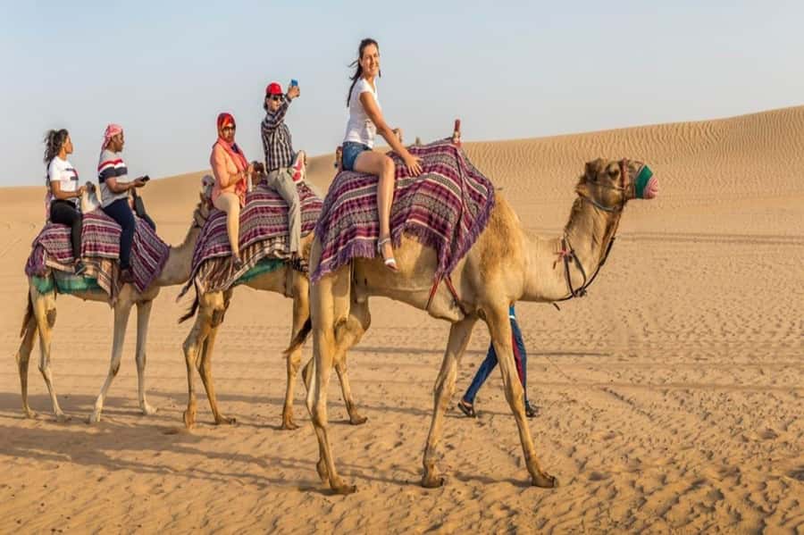 Dubai: Desert Safari Camel Riding, Sandboarding & BBQ Dinner - Hotel pickup and the first desert stop