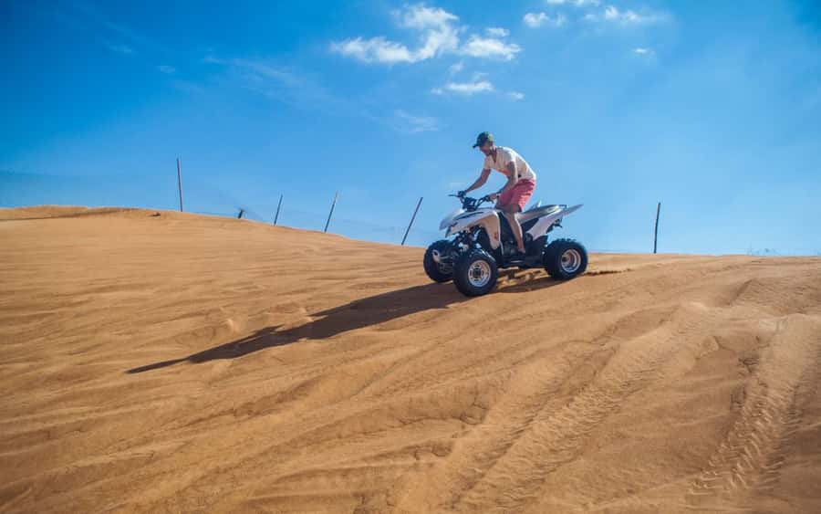 Dubai: Desert Safari, Quad Bike, Camel Ride and Sandboarding - Guides can shape the entire outing
