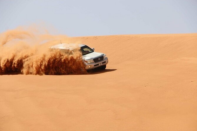 Dubai Desert Safari Red Dune: BBQ, Camel Ride & Sandboarding - Sunset photos before the dinner show
