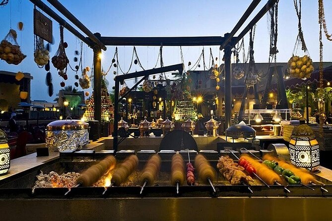 Dubai Desert Safari Red Dune: BBQ, Camel Ride & Sandboarding - BBQ buffet with belly dance, Tanura, and fire