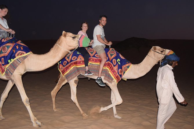 Dubai Desert Safari with BBQ, 3 Shows & Camel Ride at Majlis Camp - Sunset, sandboarding, and the short camel ride