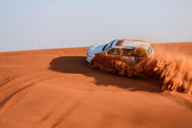 Dubai Desert Safari with BBQ and 4WD Land Cruiser Dune Bashing - Land Cruiser dune bashing on the sand