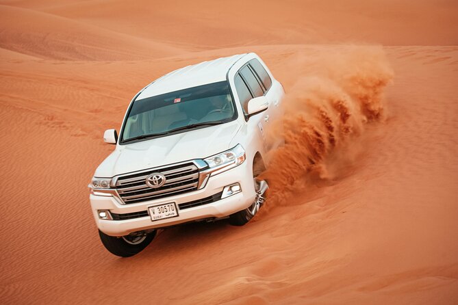 Dubai Desert Safari with BBQ Dinner and Live Shows - Belly dancing, tanura, and the fire show