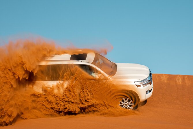 Dubai Desert Safari with Belly Dance, Fire Show and Tanura Show-The Full Package - Arabic coffee, dates, and camp food