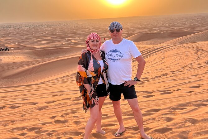 Dubai Desert Safari with Camel Ride, Sand surf, & BBQ Dinner - Belly dancing and live evening entertainment